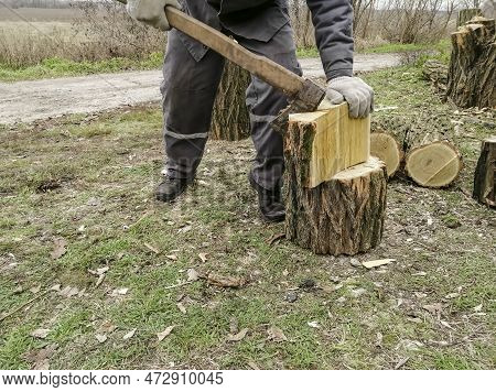 Chopping Firewood Before Winter - Man, Axe And Wood. A Man Chops Wood. The Process Of Chopping Wood 