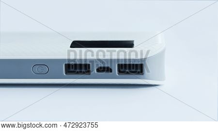 A White Flat Power Bank Isolated On White Background With Two Usb Output And One Input Socket Electr