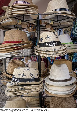 Alvor, Portugal, March 2023 - Souvenir Hats On A Display Stand In The Town Of Alvor, Algarve, Portug