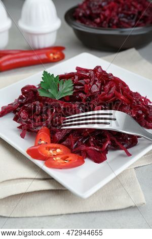 Tasty Red Cabbage Sauerkraut With Chili Pepper And Parsley Served On Light Table