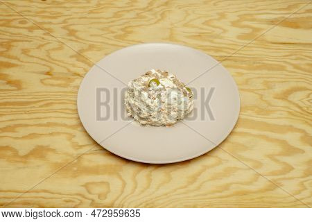 Ration Of Russian Salad With Mayonnaise, Cooked Potato And Canned Tuna With Olives And Carrots To Se
