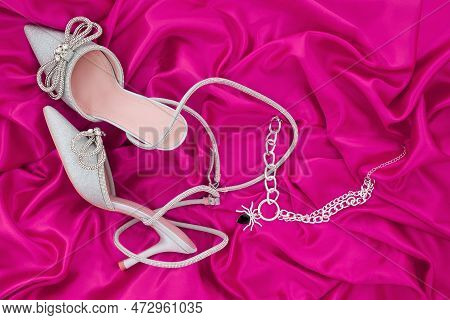 High Heel Shoes  On A Pink  Background