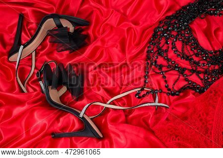 High Heel Shoes  On A Red Background