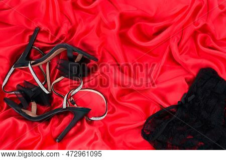 High Heel Shoes  On A Red Background