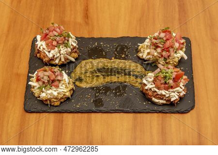 Mixed Venezuelan Patacones With A Lot Of Cheese, Pico De Gallo, Spreadable Sauce, Chicken And Pork C