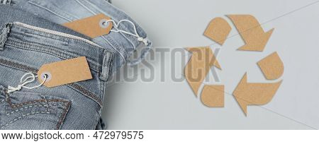 Stack Of Gray Jeans With Empty Tags. Long Panoramic Banner With Circular Fashion, Eco Friendly Susta