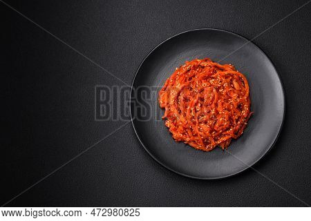 Dried Squid Chopped Into Slices And Seasoned With Sesame Seeds And Spices