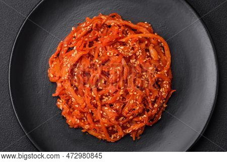 Dried Squid Chopped Into Slices And Seasoned With Sesame Seeds And Spices