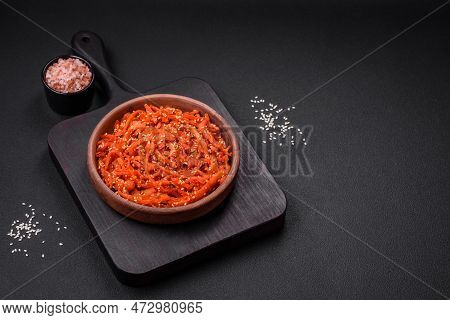 Dried Squid Chopped Into Slices And Seasoned With Sesame Seeds And Spices