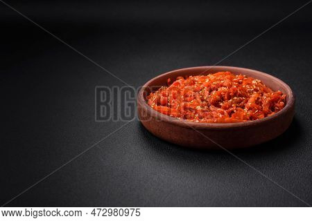 Dried Squid Chopped Into Slices And Seasoned With Sesame Seeds And Spices