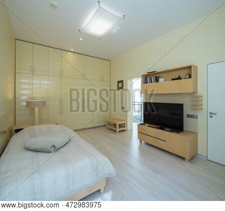 Modern Scandic Interior In Beige Tones Of Bedroom In Luxury Apartment.