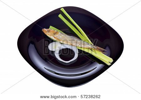 Smoked Fish, Salad And Onion On A Black Plate