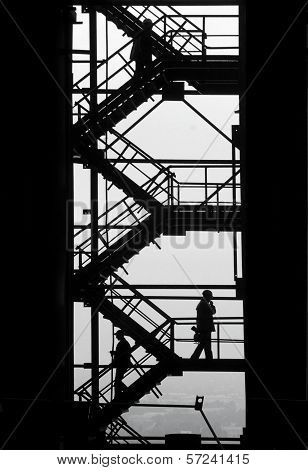 Workpeople Silhouettes At The Industrial Project