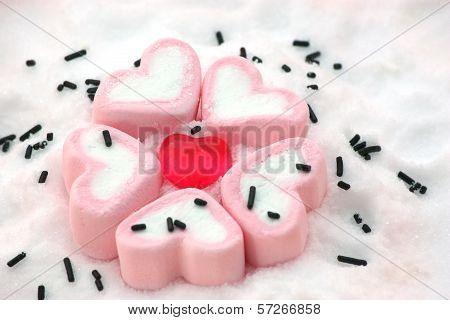 Heart Shape Candy Around By Marshmallows On Snow