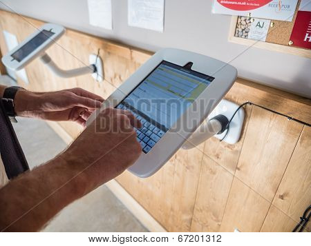Man Using A Small Sized Terminal