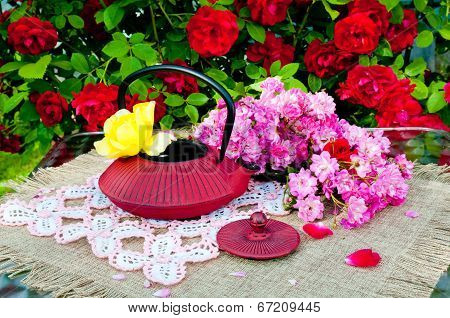 still life bouquet with roses and tea pot