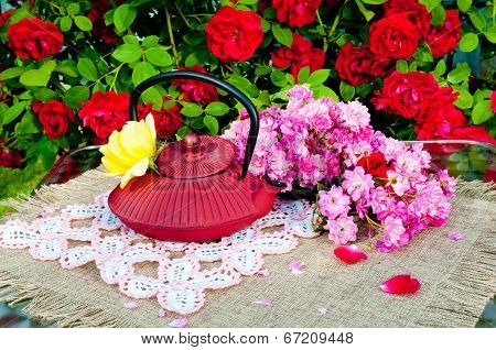 still life bouquet with roses and tea pot