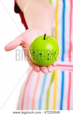 Closeup Housewife Or Chef In Kitchen Apron Using Apple Timer