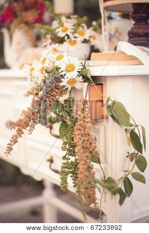 Shabby Chic Decor, White Table With Vintage Objects On It, Flowers Vase, Flower Pot, An Opened Book