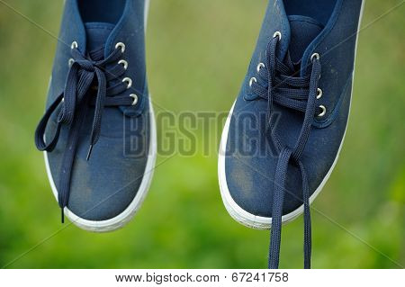 Dirty Blue Sneakers On Clothes Line