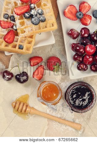 Sweet waffles with honey and berries