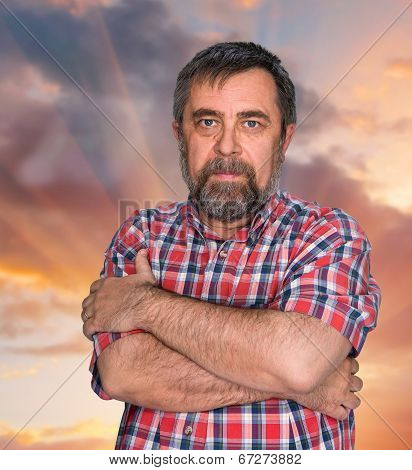 Middle-aged Man On Cloudy Sky Background