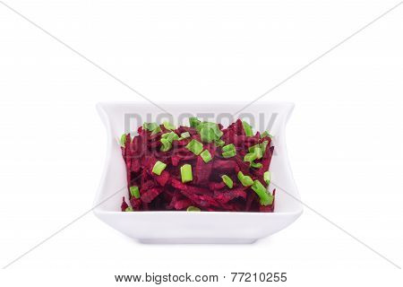 Fresh homemade Beetroot Salad with green onions isolated on white background