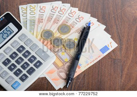 Calculator and money on the table
