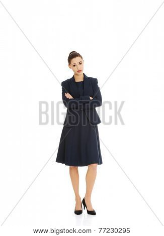 Anoyed and displeased businesswoman standing