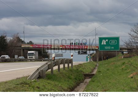 Highway in Brno, people on bridge welcome Dragoon Ride - US Army Convoy