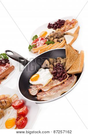 Fried egg with bacon in a frying pan.