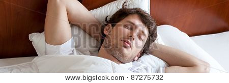 Man Sleeping In Bed