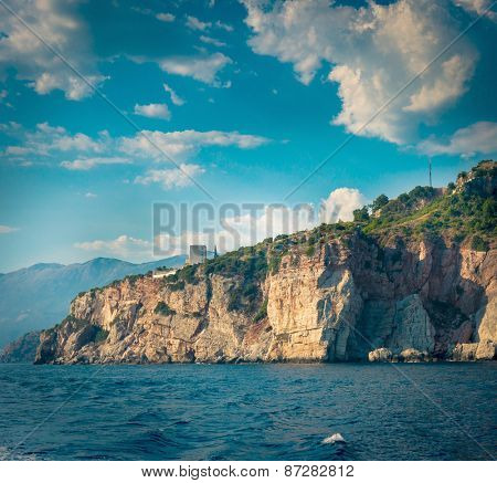 The high cliffs next to the central beach of Budva make the coastline even more scenic and romantic for boat trips, Montenegro.
