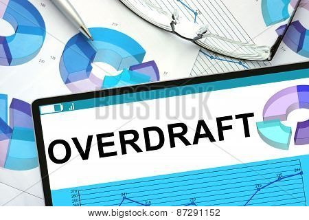 Overdraft on tablet with graphs.