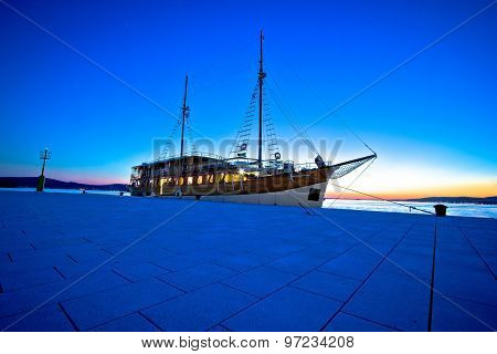 Old Wooden Sailboat At Blue Evening