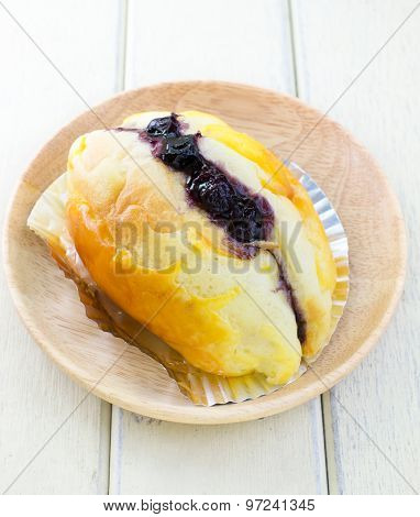Butter Bread Top Up With Blueberry Sauce With White Background
