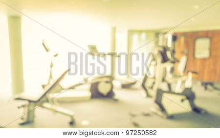 Abstract blur Fitness center with traineger equipments  ( Filtered image processed vintage effect. )
