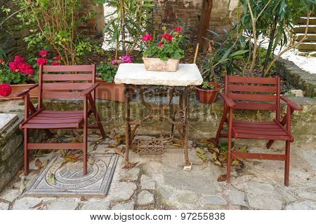 Chairs and table on the backyard of an istrian house in Croatia.