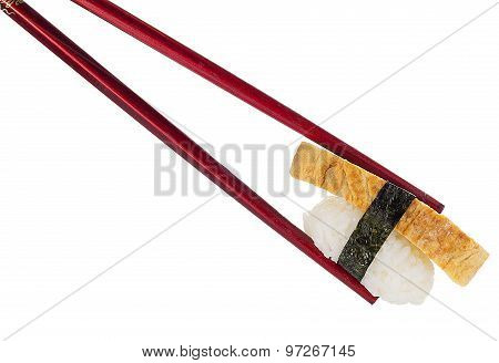 Tomago Sushi In Chopsticks Isolated On White Background