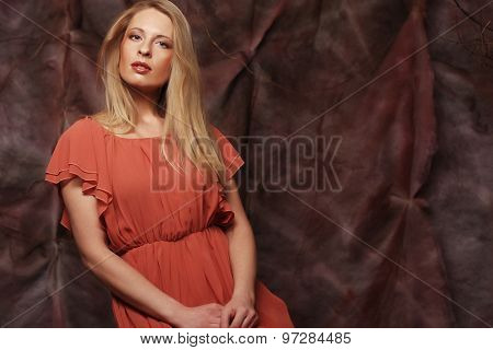 elegant sensual young woman in red dress