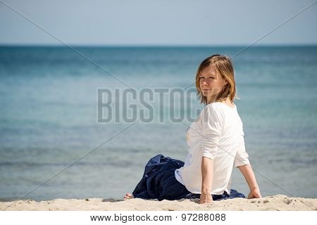 Woman sitting at the beach