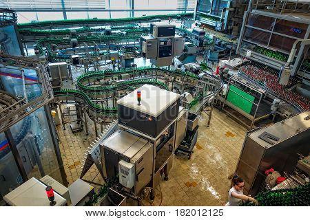 Ceske Budejovice, Czech Republic - June 30, 2016: Budvar Budweiser brewery. Bottle sorting washing and beer bottling workshop with assembly-lines.