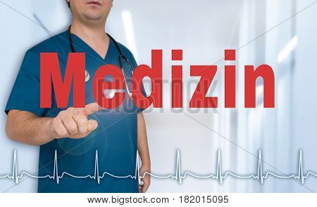 Medizin (in German Medical) Doctor Showing On Viewer With Heart Rate Concept
