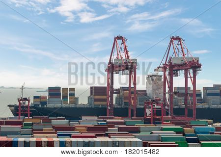 Industrial port with containers Shanghai Yangshan deepwater port is a deep water port for container ships in Hangzhou Bay south of Shanghai China.