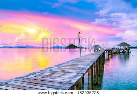 Dramatic sunset sky on tropical beach in summer season Scenery sea and island at Koh Mak Island TradThailand - Vacations And Tourism Concept.