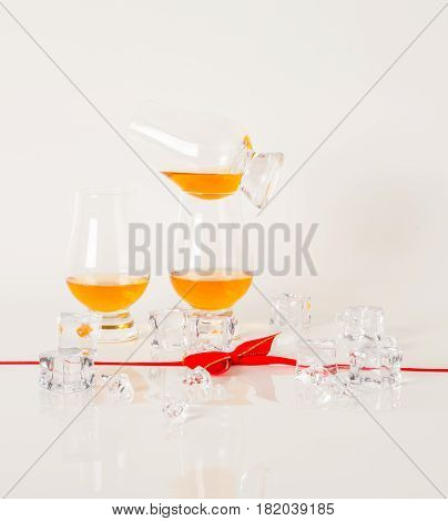 Set Of Single Malt Tasting Glasses, Single Malt Whisky In A Glasses, White Background, Red Bow
