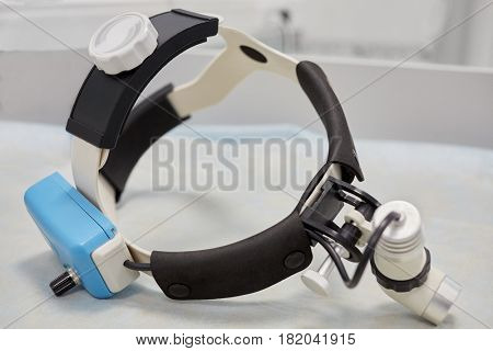 Examination lamp headset on table.