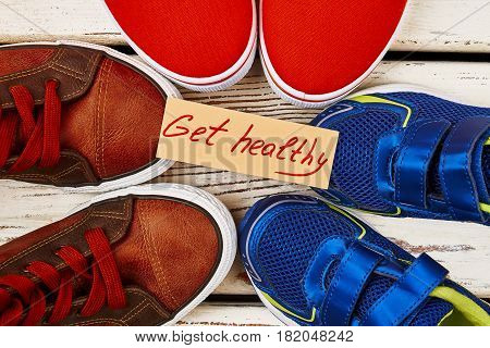 Sport shoes and motivation card. Healthier you from today.