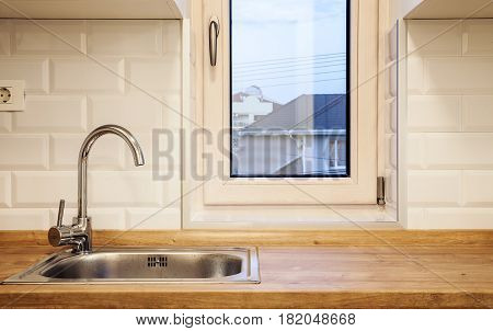 Water Faucet And Desk Of A Modern Kitchen