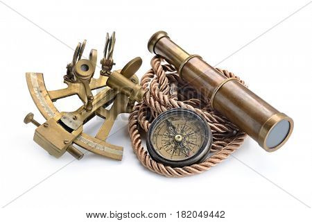 vintage still life with compass,sextant and spyglass